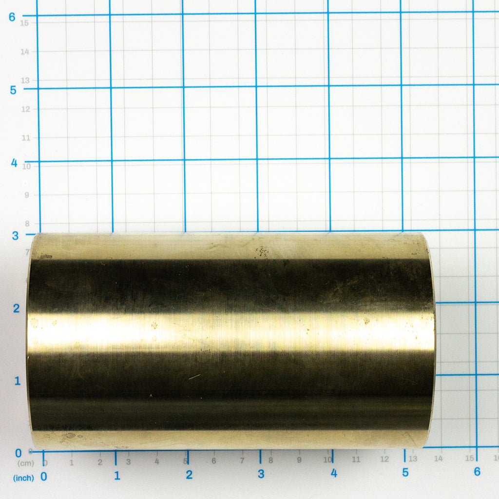 Roller Assembly Bushing, Labrie part 100189, shown on a measuring grid