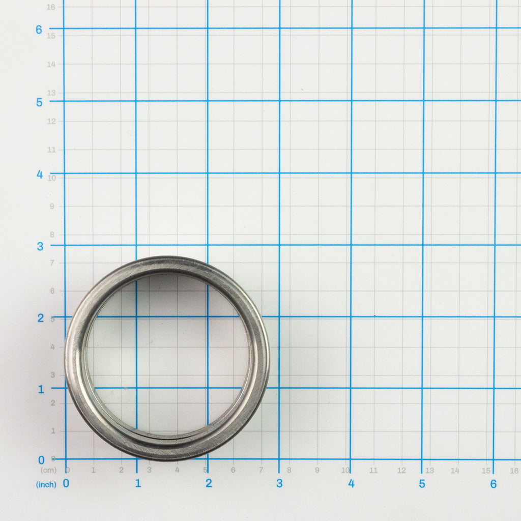 Sleeve Bushing, Labrie part 70973, shown on a measuring grid