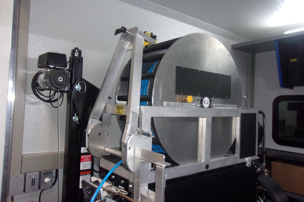 CUES Evolution Series III interior, cable reel with winch lift arm in the equipment room