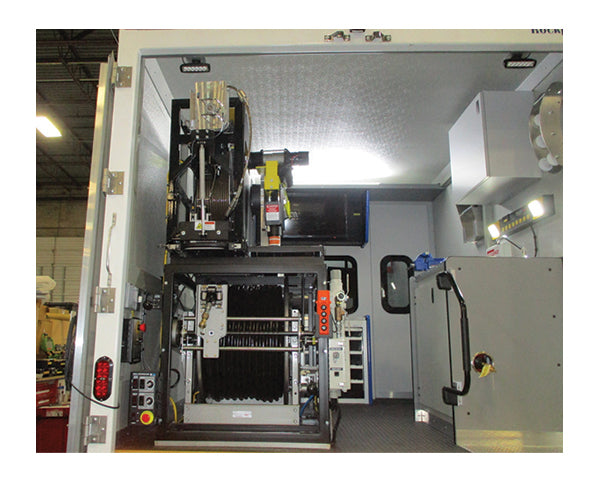 Interior of a CUES cutter vehicle seen through the open rear doors