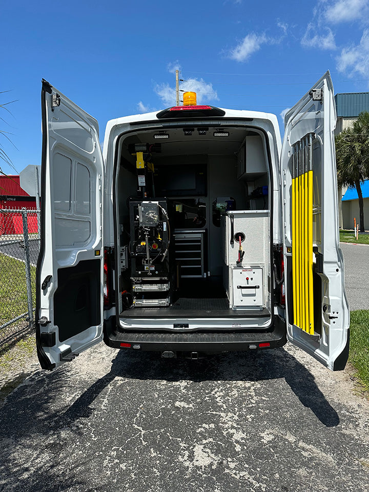 CUES inspection van, rear view with both doors open and the equipment inside