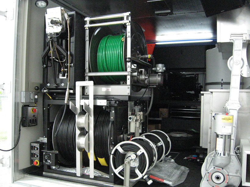 CUES inspection truck equipment room with cable and hose reels