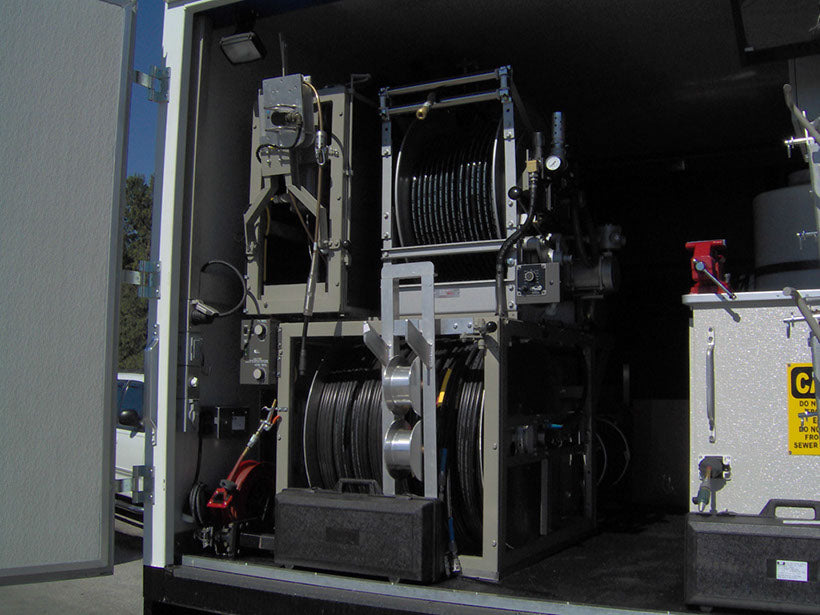 CUES inspection truck equipment room with cable reel and hose reels