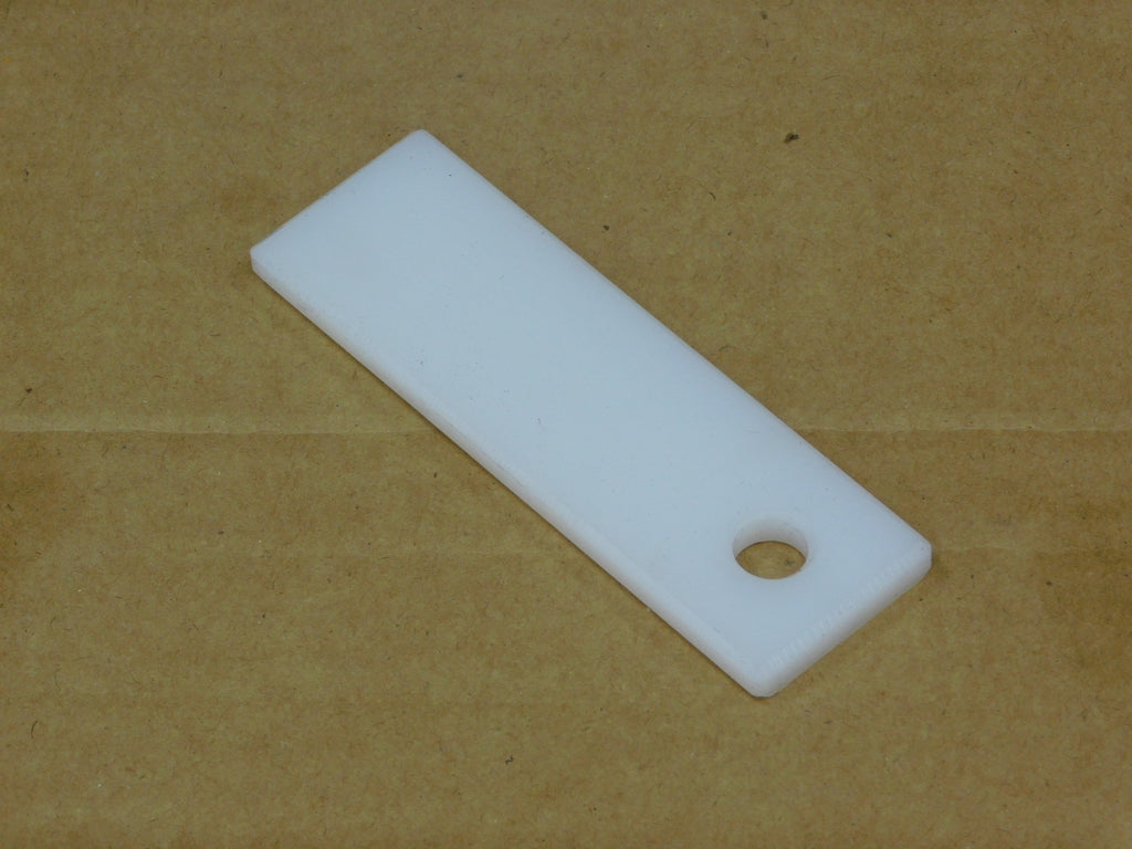 1-3/8 x 4-5/8 Teflon, Labrie part HYV30241, shown on a measuring grid