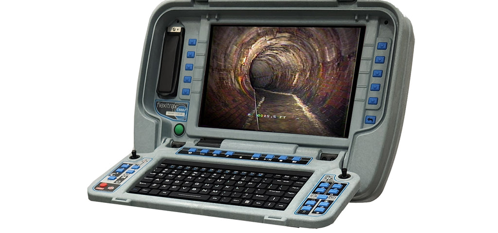 Control unit with screen, keyboard and joysticks showing a sewer pipe view